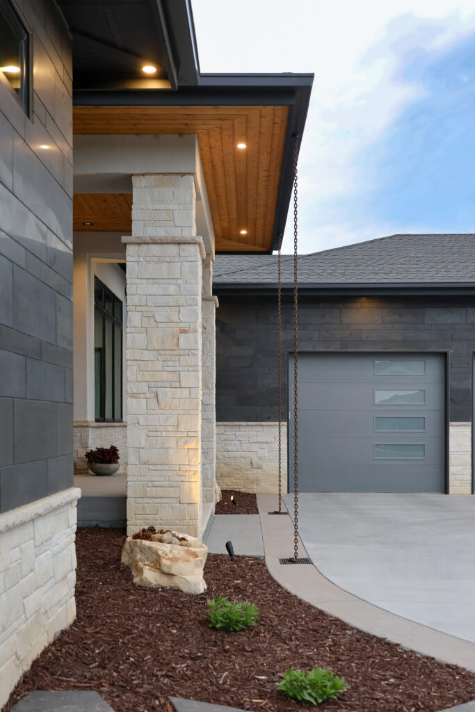 The front of a house with a garage door.